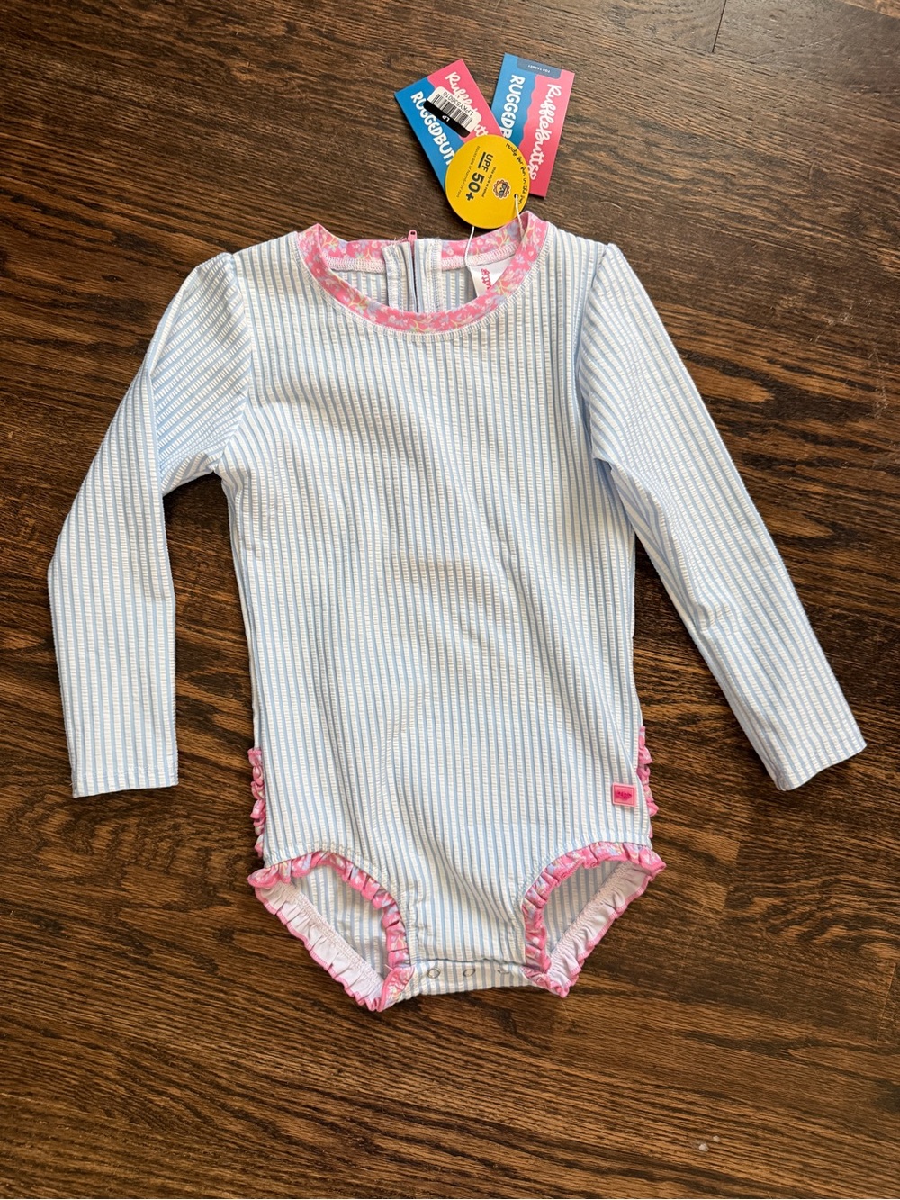 RuffleButts Toddler Girls’ Pink-Trim Blue Stripe Long-Sleeve One-Piece Swimsuit